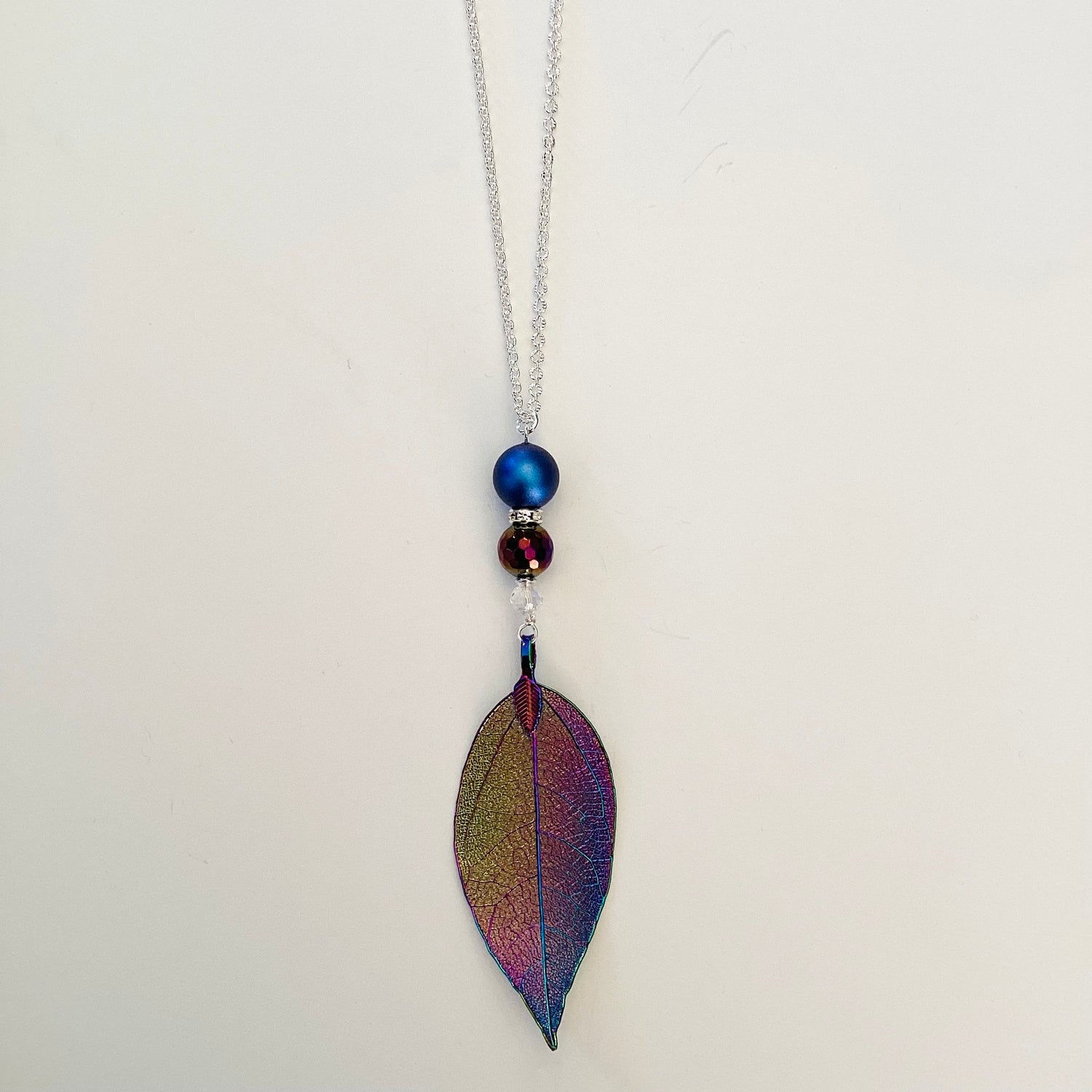 Oil Slick Leaf Necklace in Iridescent Blue